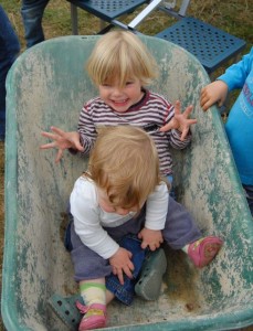 two-children-in-a-wheelbarrow