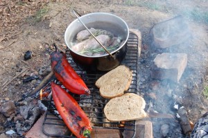 Sausage and wild garlic stew cooking on the campfire