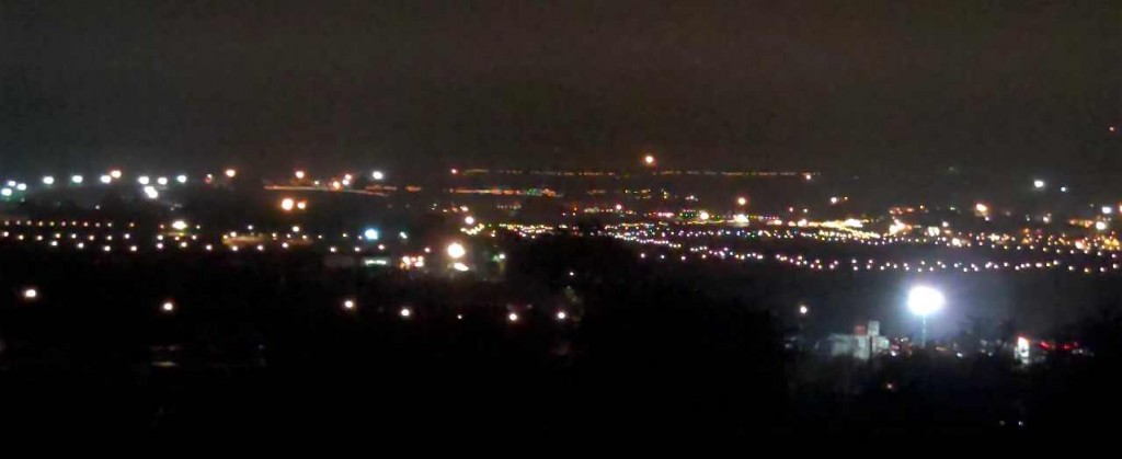 The lights of Glastonbury festival as seen at night