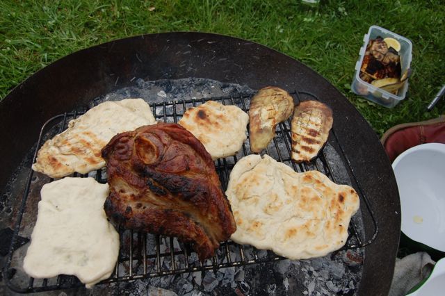 Lamb shoulder with flatbreads and aubergine on the campfire