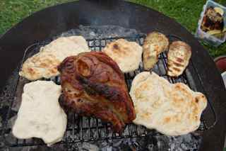 Cath’s campfire roast dinner: Lamb shoulder with aubergine and flat bread